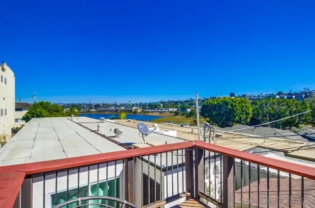 a view of a balcony with floor to ceiling windows yard and outdoor view