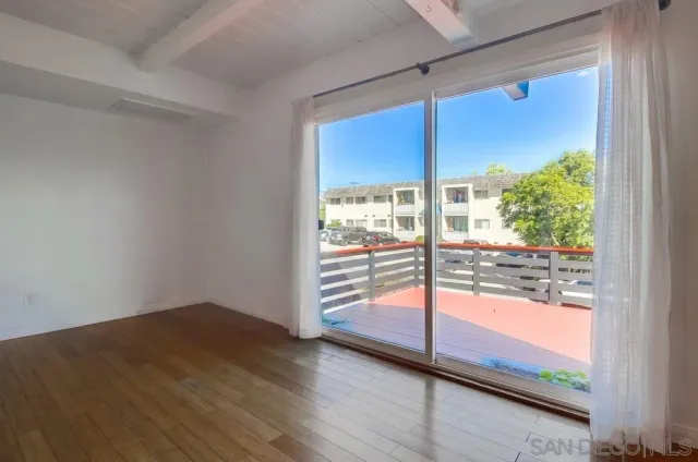 a view of a room with a large window