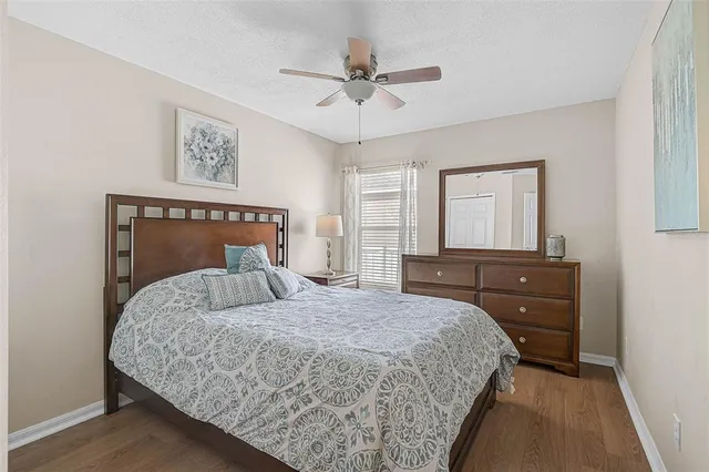 a bedroom with a bed and a dresser