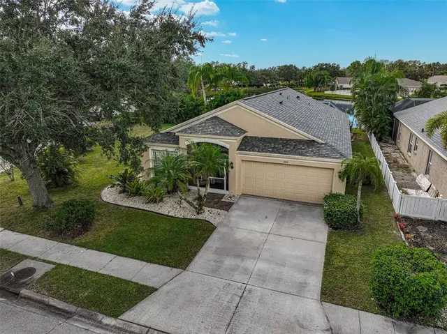 a aerial view of a house with a yard