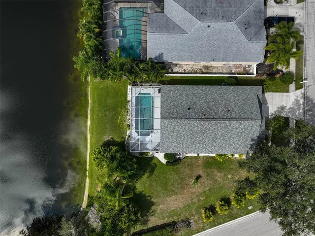 an aerial view of a house having yard