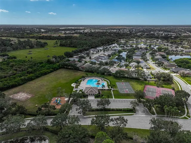 an aerial view of a house with a lake view