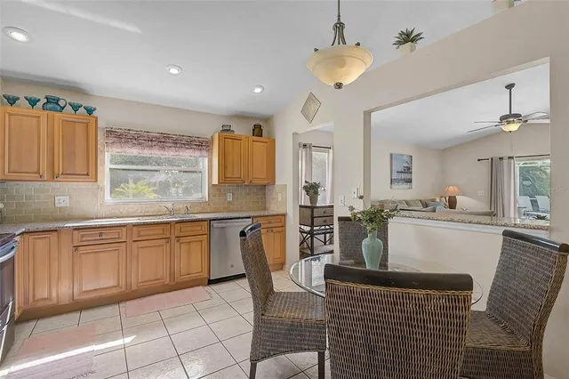 a kitchen with cabinets and window