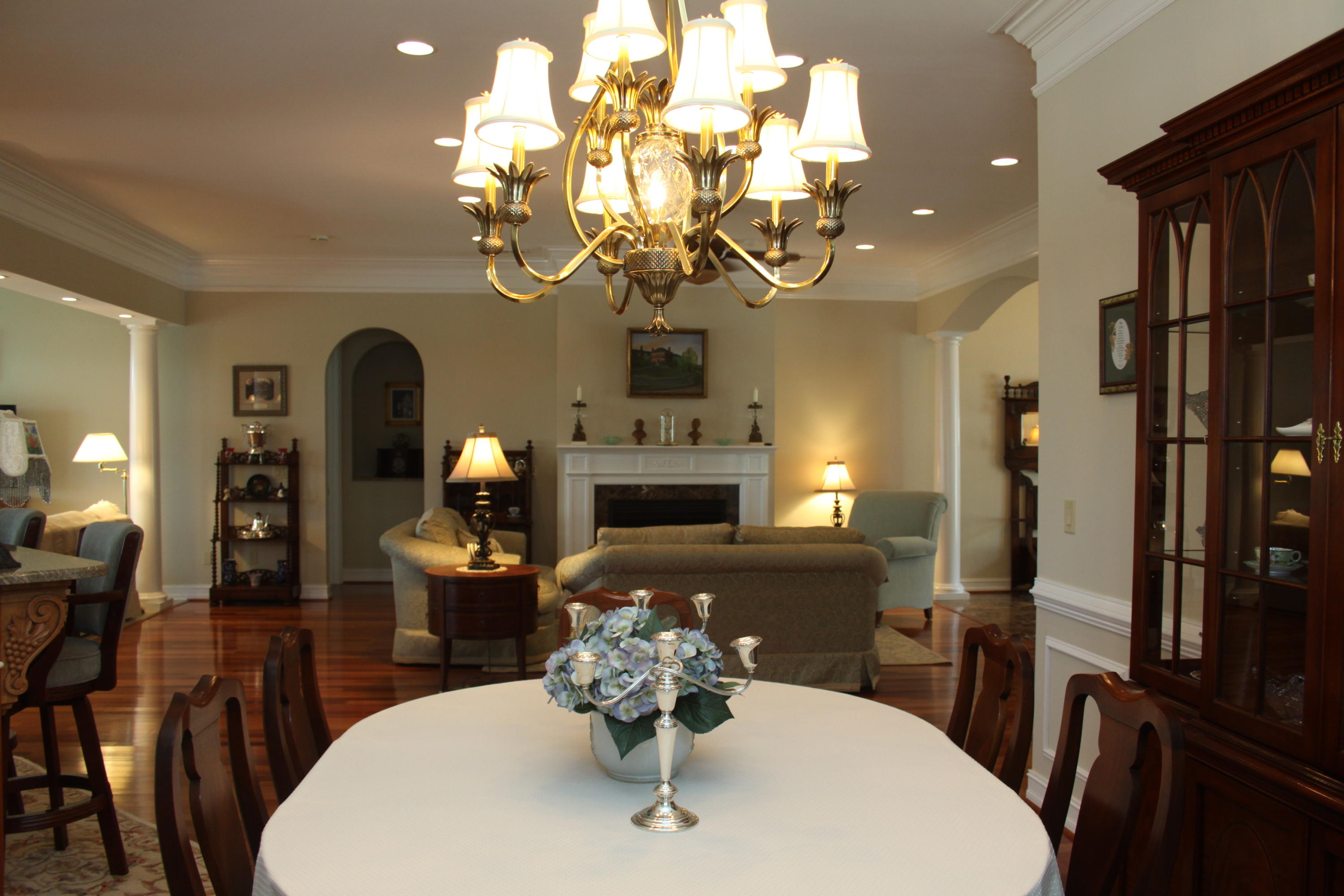 159 Calypso Road Moneta, VA 24121 - Photo 19 of 72 a dining room with furniture a chandelier and wooden floor