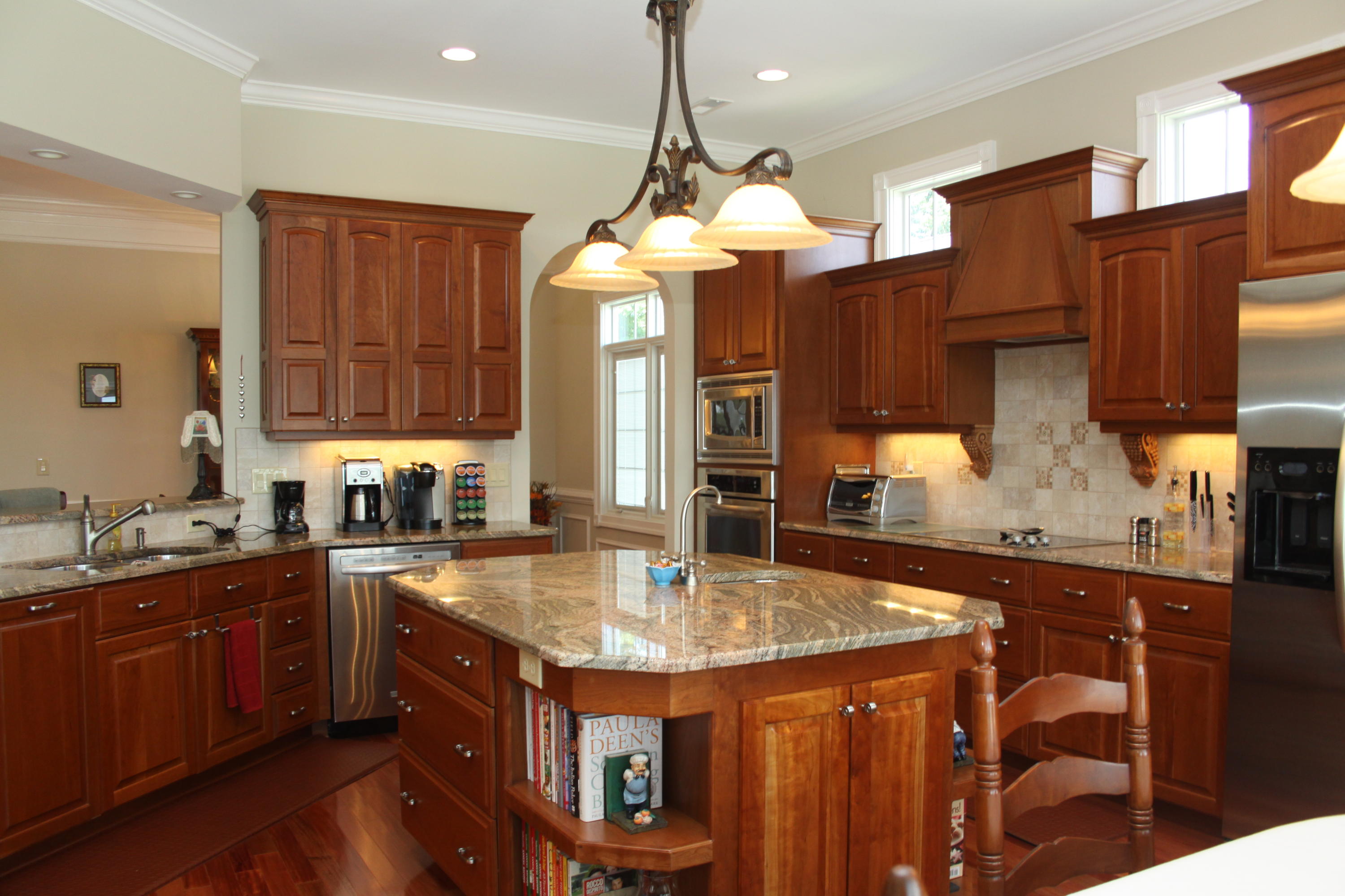 159 Calypso Road Moneta, VA 24121 - Photo 20 of 72 a kitchen with stainless steel appliances granite countertop a sink a stove and a wooden cabinets