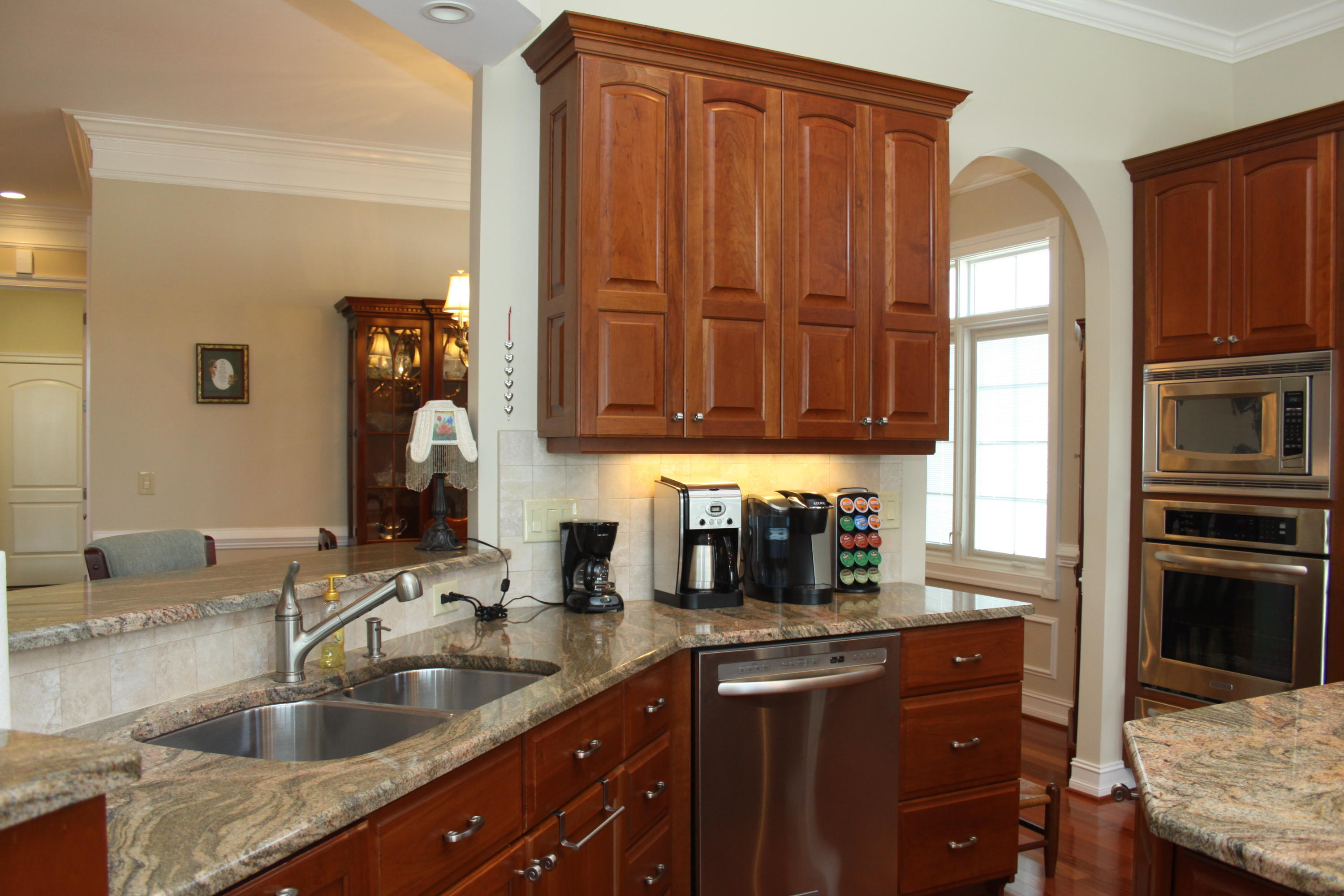 159 Calypso Road Moneta, VA 24121 - Photo 22 of 72 a kitchen with granite countertop a sink cabinets and stainless steel appliances