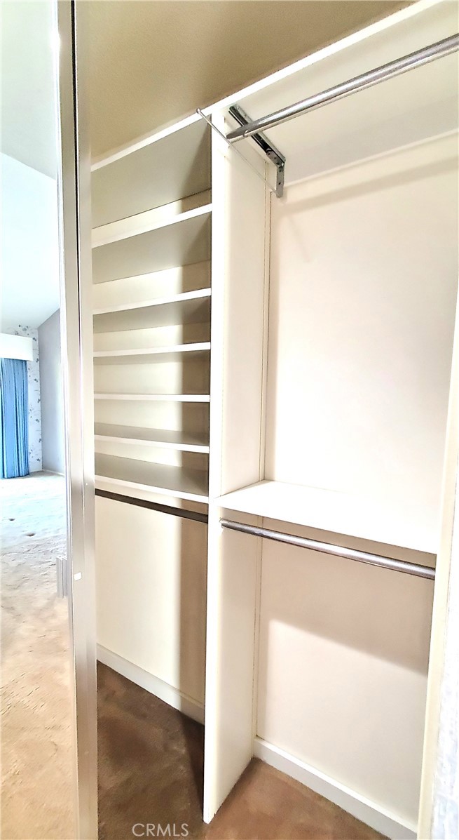 7 Del Rey, Unit 10 Irvine, CA 92612 - Photo 44 of 75 Primary Suite 2nd closet with mirror and organizer