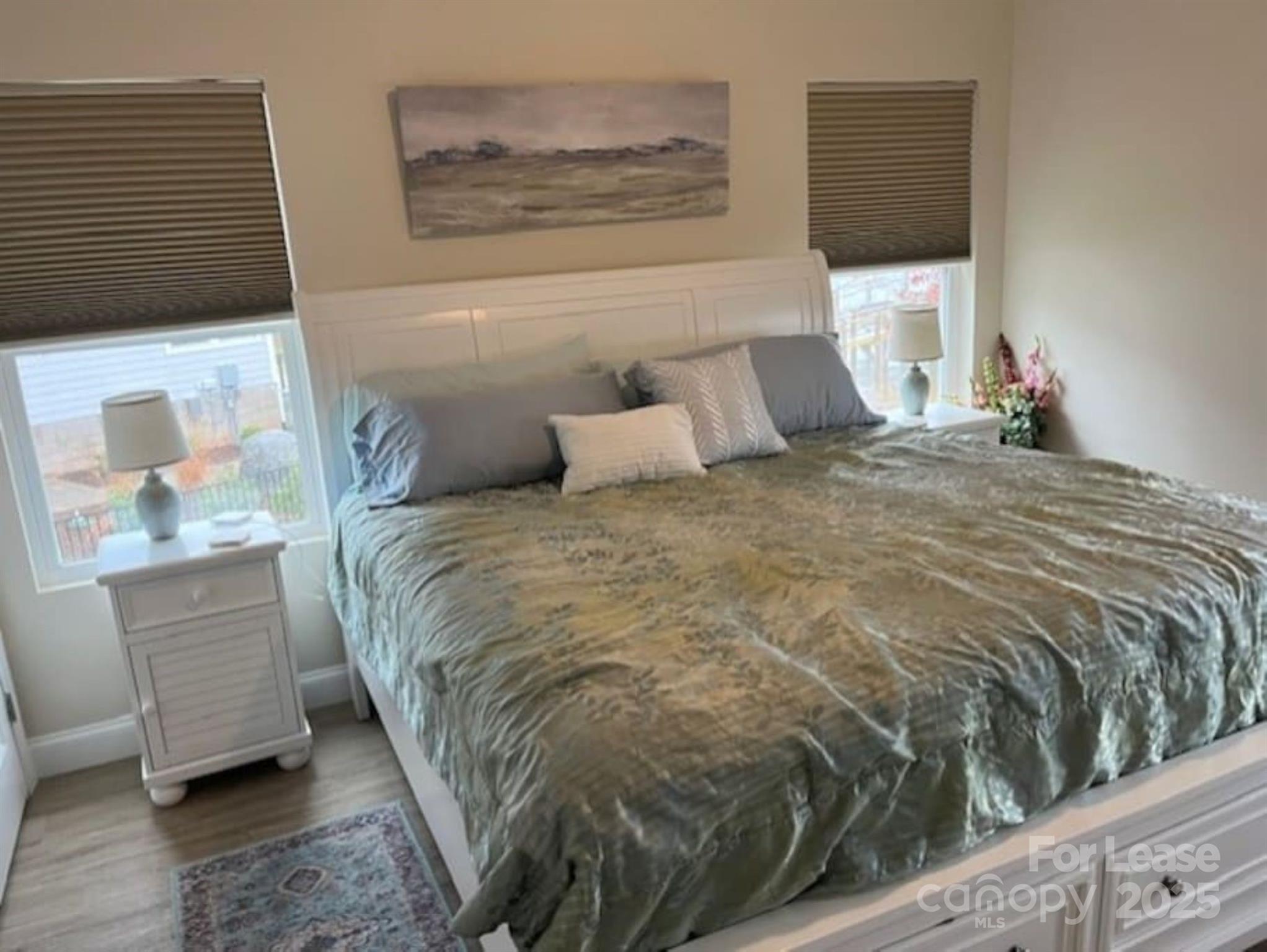 4897 Kiser Island Road, Unit B Terrell, NC 28682 - Photo 7 of 18 a bed sitting in a bedroom next to a window