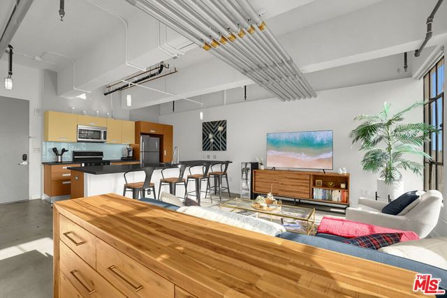 a room with fireplace furniture and a flat screen tv