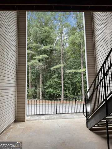 a view of a balcony with floor to ceiling window