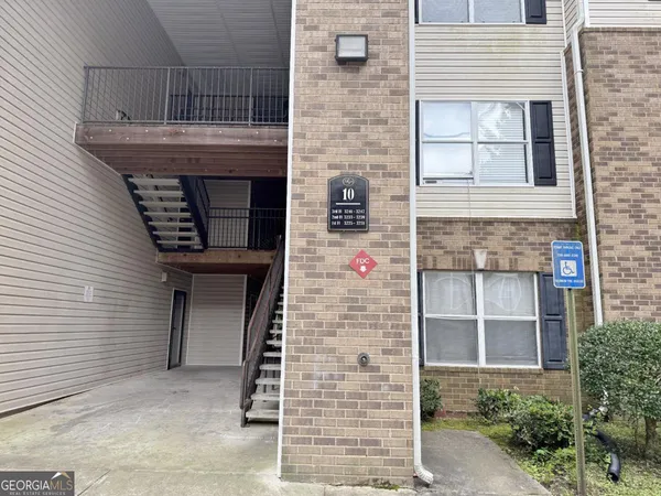 a front view of a house with large windows