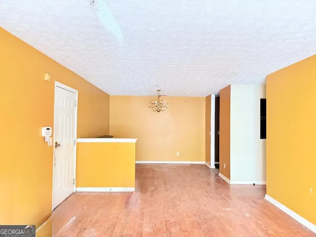a view of a room with furniture and front door
