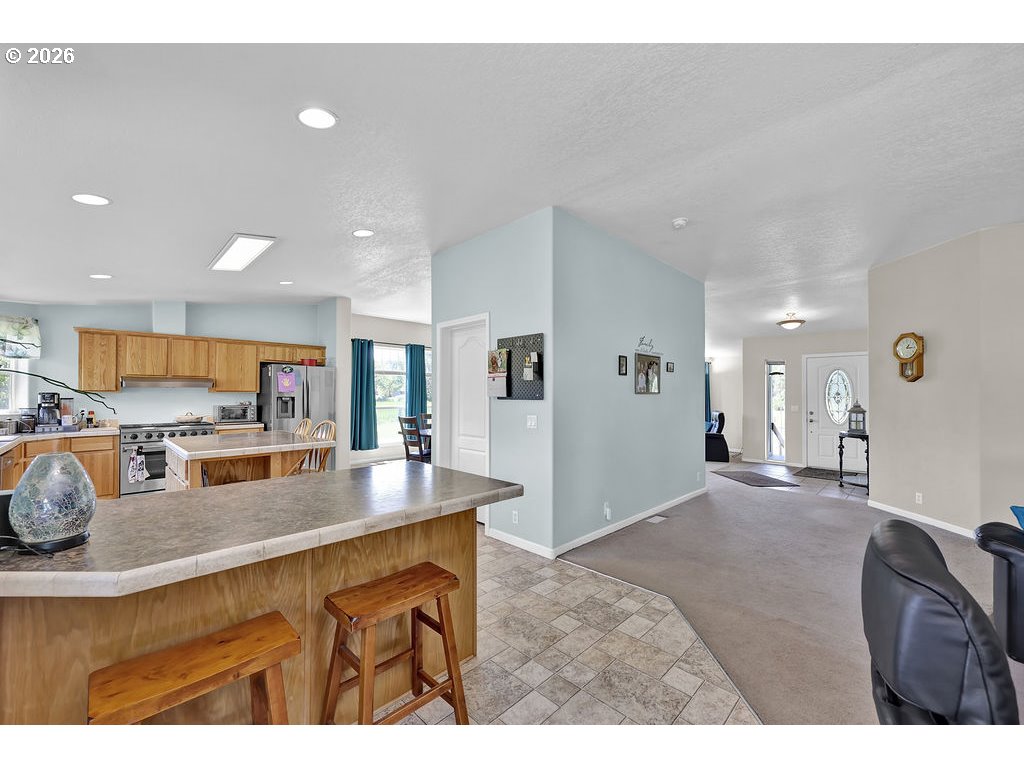 38277 Wheeler Road Dexter, OR 97431 - Photo 15 of 47 a kitchen with refrigerator and window
