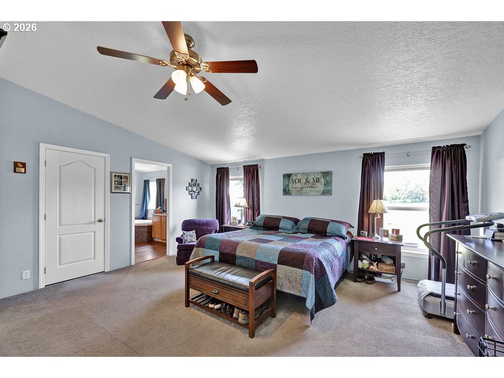 38277 Wheeler Road Dexter, OR 97431 - Photo 19 of 47 a living room with furniture a ceiling fan and a window