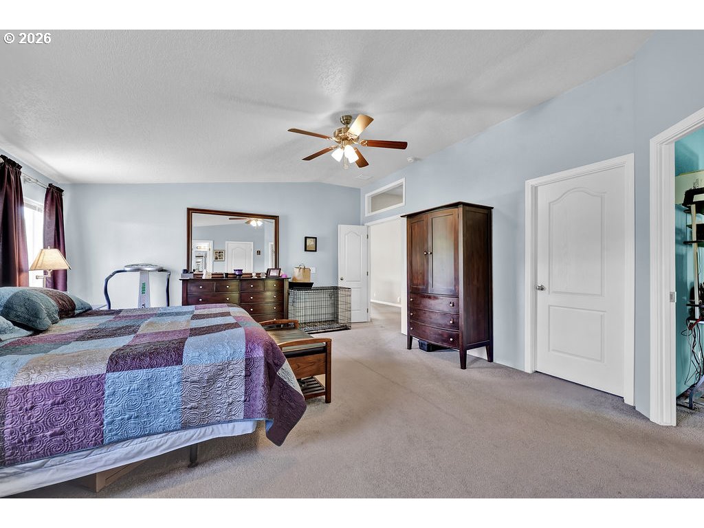 38277 Wheeler Road Dexter, OR 97431 - Photo 21 of 47 a bed room with furniture and a chandelier