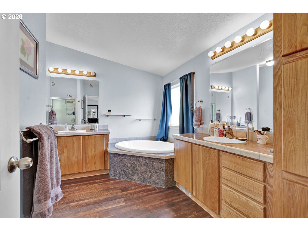 38277 Wheeler Road Dexter, OR 97431 - Photo 22 of 47 a bathroom with a sink a toilet and mirror