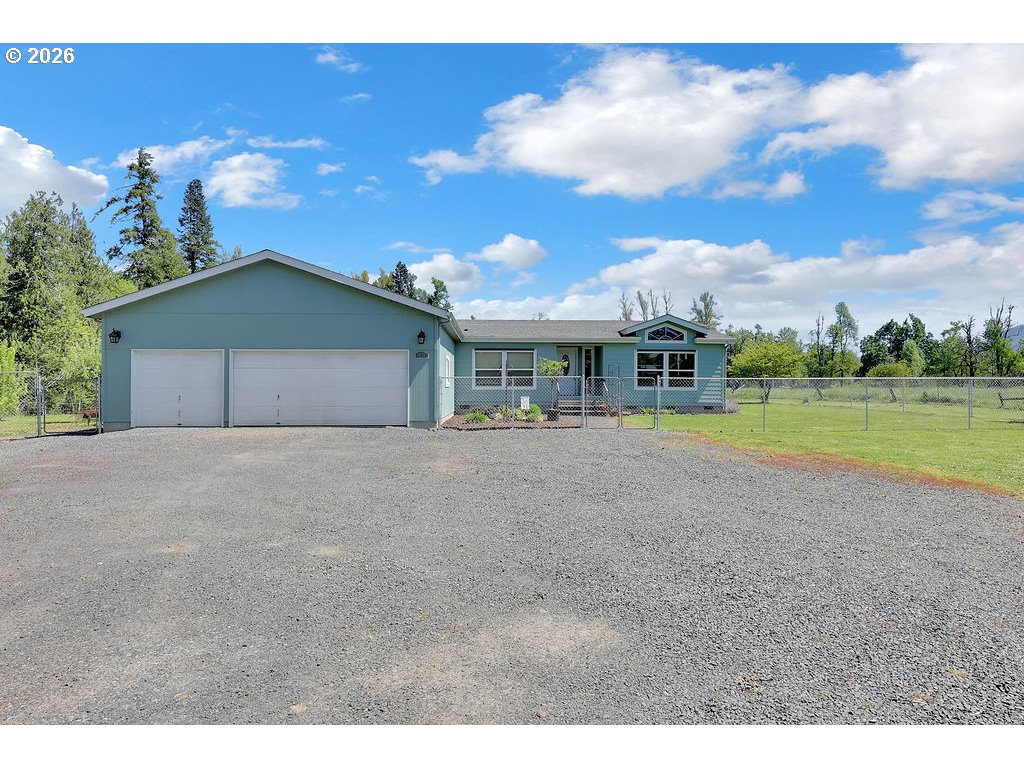 38277 Wheeler Road Dexter, OR 97431 - Photo 3 of 47 a view of a house with a yard and garage