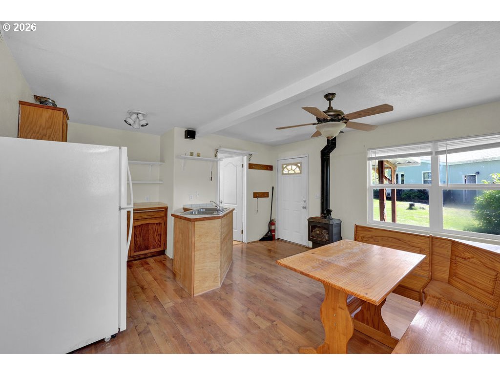 38277 Wheeler Road Dexter, OR 97431 - Photo 32 of 47 a open kitchen with a table and chairs