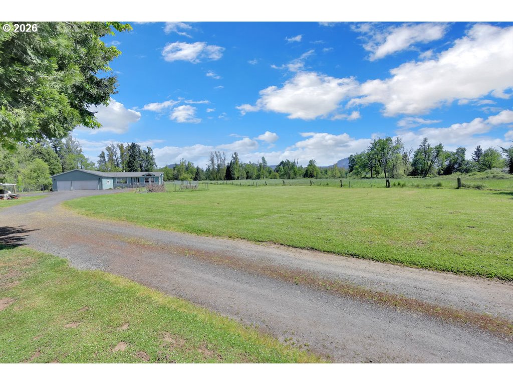 38277 Wheeler Road Dexter, OR 97431 - Photo 44 of 47 a view of a yard with a house