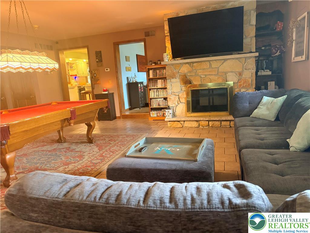 100 Hazelwood Road Lehighton, PA 18235 - Photo 5 of 31 a living room with furniture and a flat screen tv