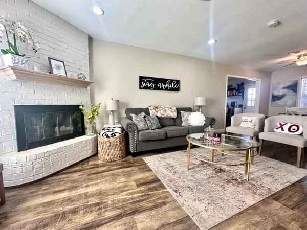 a living room with furniture and a fireplace