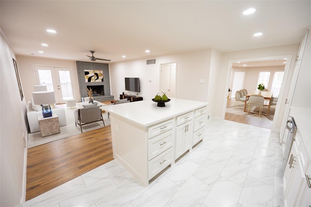 6105 Rincon Way Dallas, TX 75214 - Photo 3 of 11 a kitchen with sink a counter top space and living room