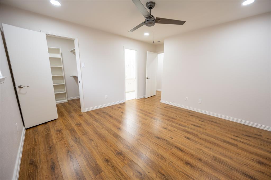 6105 Rincon Way Dallas, TX 75214 - Photo 8 of 11 wooden floor in an empty room with a window