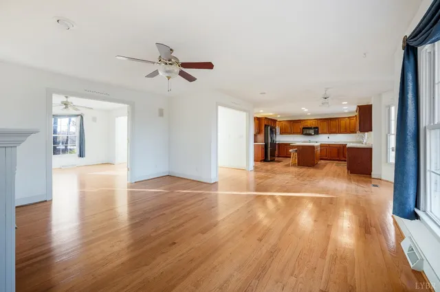 a spacious bathroom with a tub sink and mirror