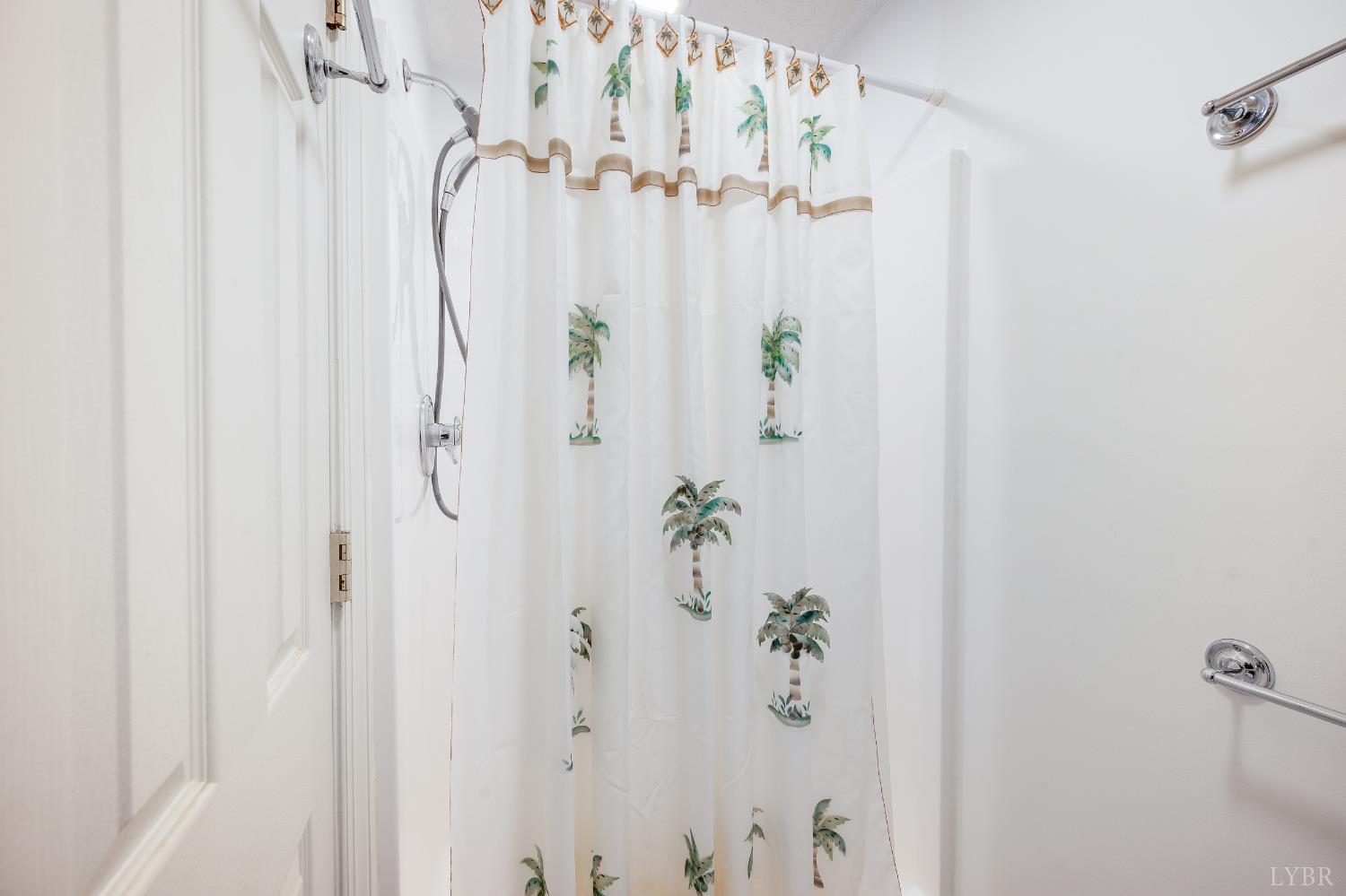 1083 High Grove Lane Forest, VA 24551 - Photo 39 of 75 a bathroom with a shower curtain and a curtain