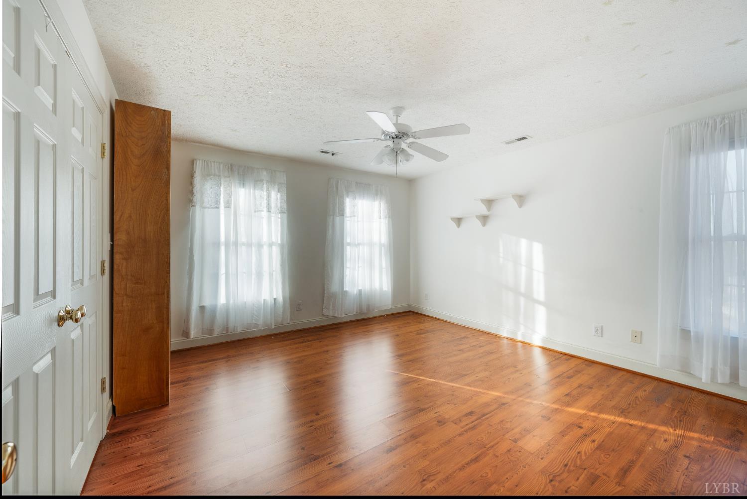 1083 High Grove Lane Forest, VA 24551 - Photo 47 of 75 a view of an empty room with window and wooden floor