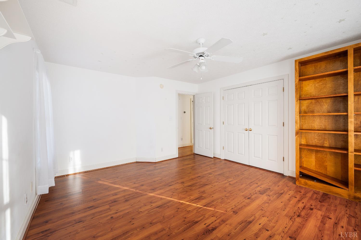 1083 High Grove Lane Forest, VA 24551 - Photo 48 of 75 a view of an empty room with a window and wooden floor