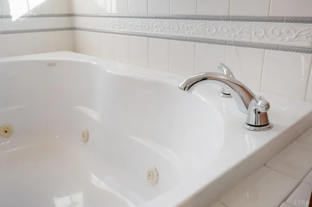 a view of a wooden door and brick wall