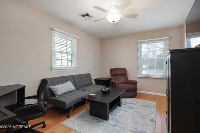 a living room with furniture and a window