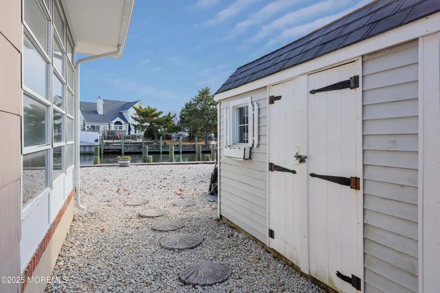 a view of a porch with wooden floor