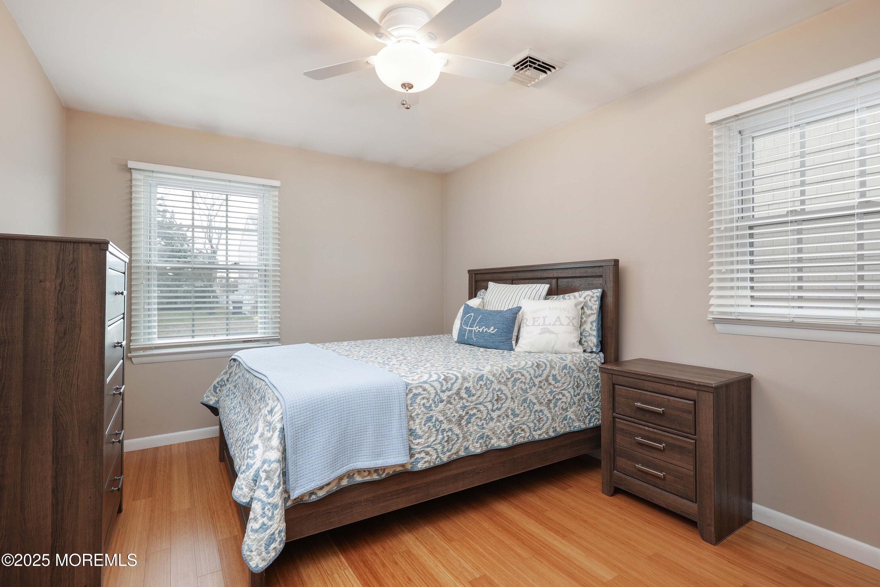 41 Longpoint Drive Brick, NJ 08723 - Photo 10 of 22 a bedroom with a bed a dresser and a window
