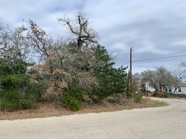 a view of a street with a building in the background