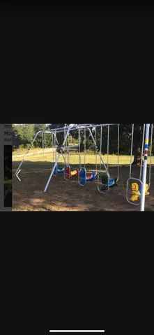 a view of swimming pool with lawn chairs