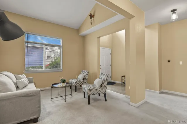 a living room with furniture and a window