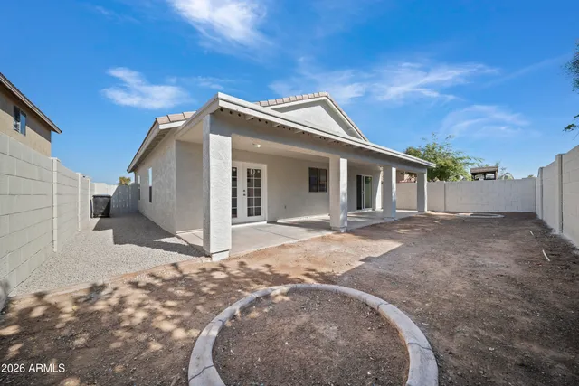 a view of a house with a backyard