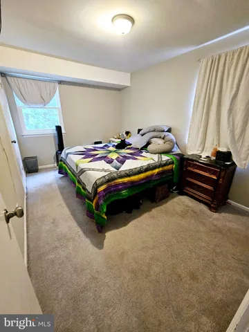 a white toilet sitting next to a shower curtain