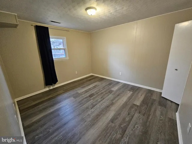 a bathroom with a double vanity sink mirror and shower