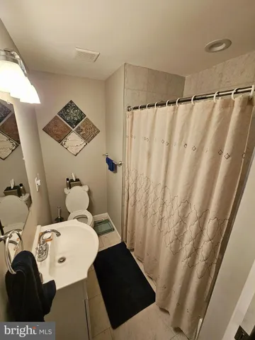 a room with multiple dryer and storage