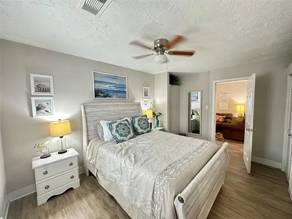 a bedroom with bed and window