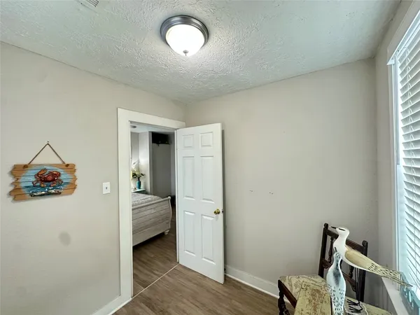 a view of a hallway with a bedroom