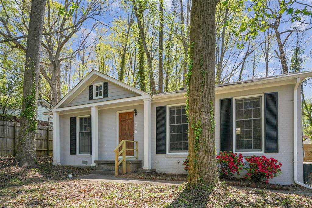 front view of a house with a yard