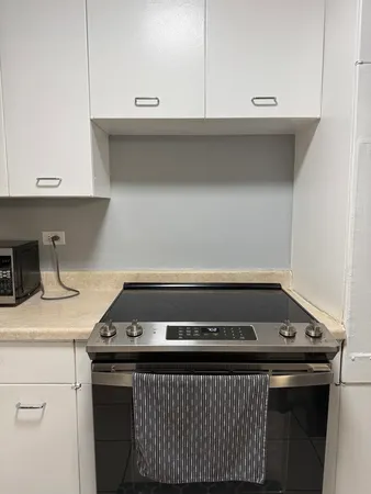 a kitchen with a stove and a sink
