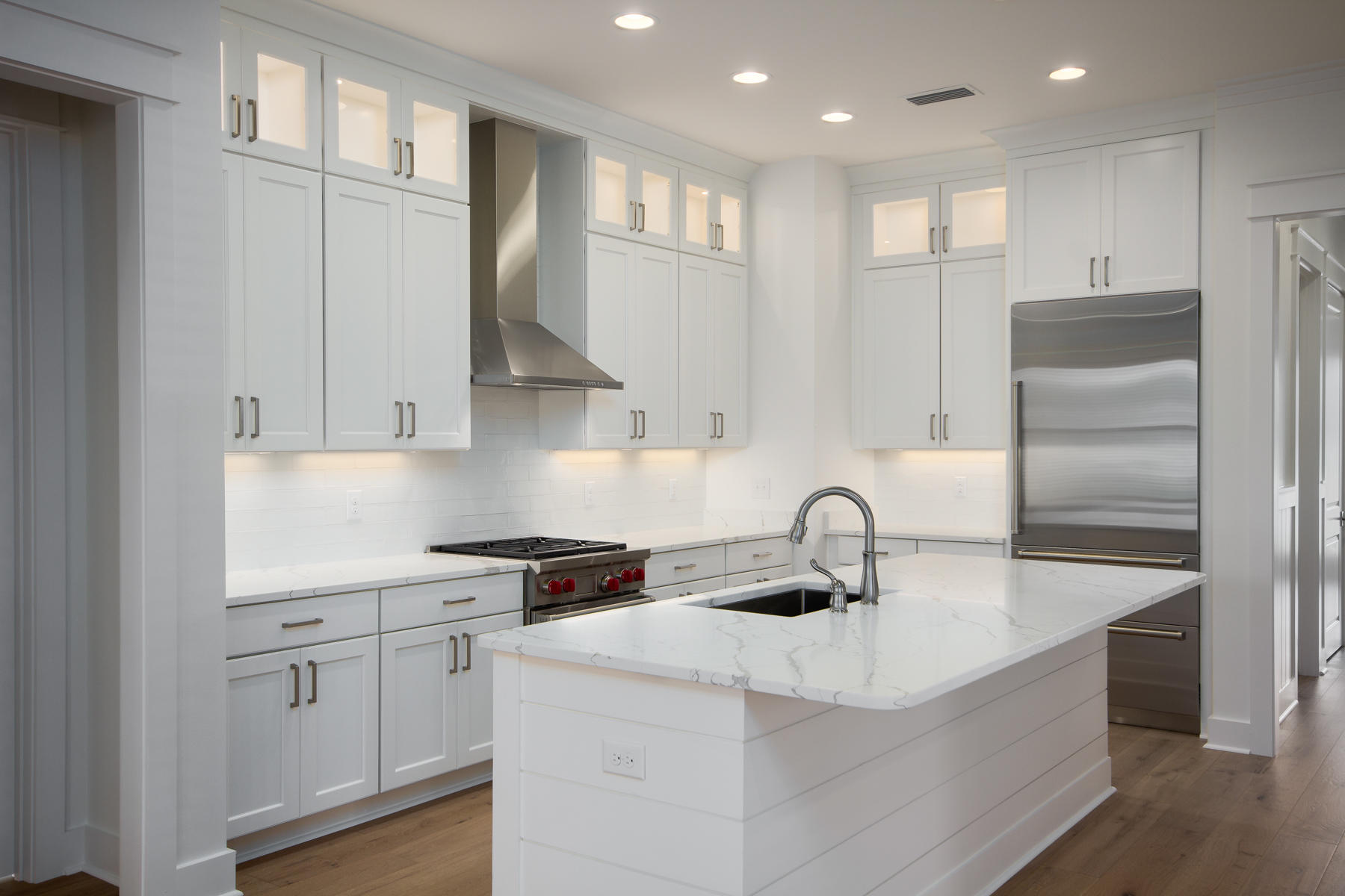 48 Sidecamp Road, Unit LOT 94 Watersound, FL 32461 - Photo 3 of 16 a kitchen with granite countertop a sink a refrigerator and cabinets