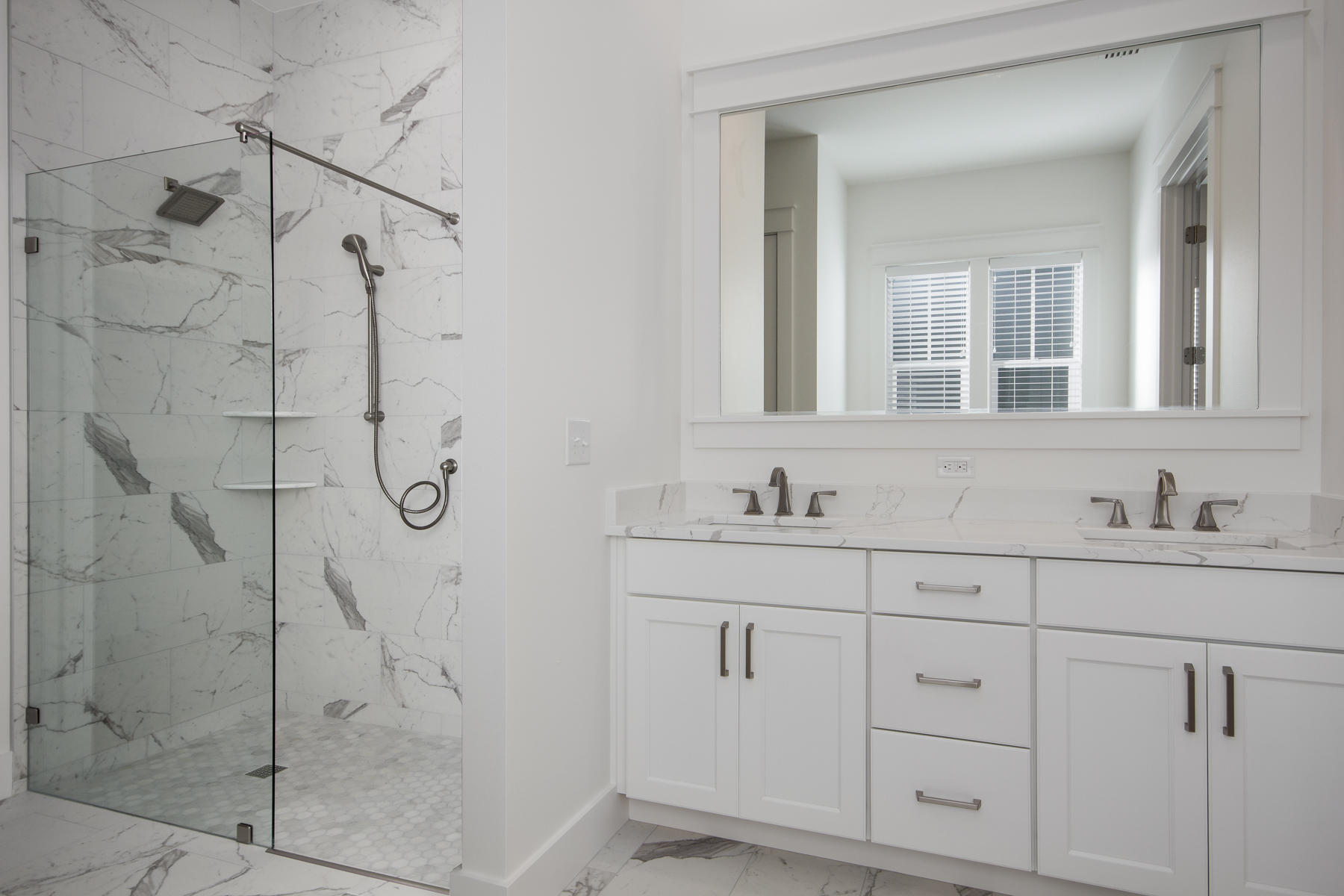 48 Sidecamp Road, Unit LOT 94 Watersound, FL 32461 - Photo 4 of 16 a bathroom with a shower sink and mirror