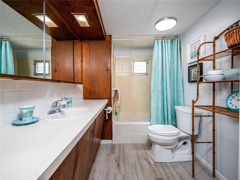 23673 Northeast 134th Lane Road Fort McCoy, FL 32134 - Photo 15 of 34 a bathroom with a sink toilet and shower