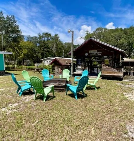 a view of a house with backyard porch and sitting area